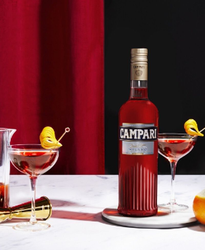 Bottle of Campari with cocktails