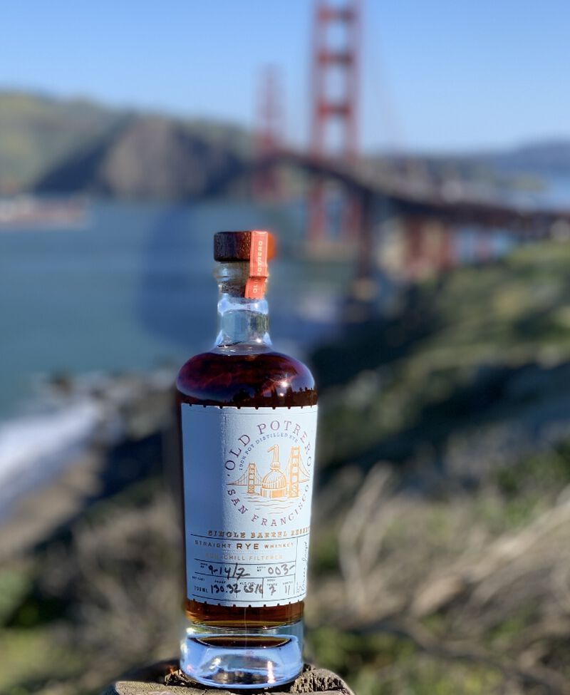 Bottle of Old Potrero Rye Whiskey Exclusive Single Barrel in front of the Golden Gate Bridge