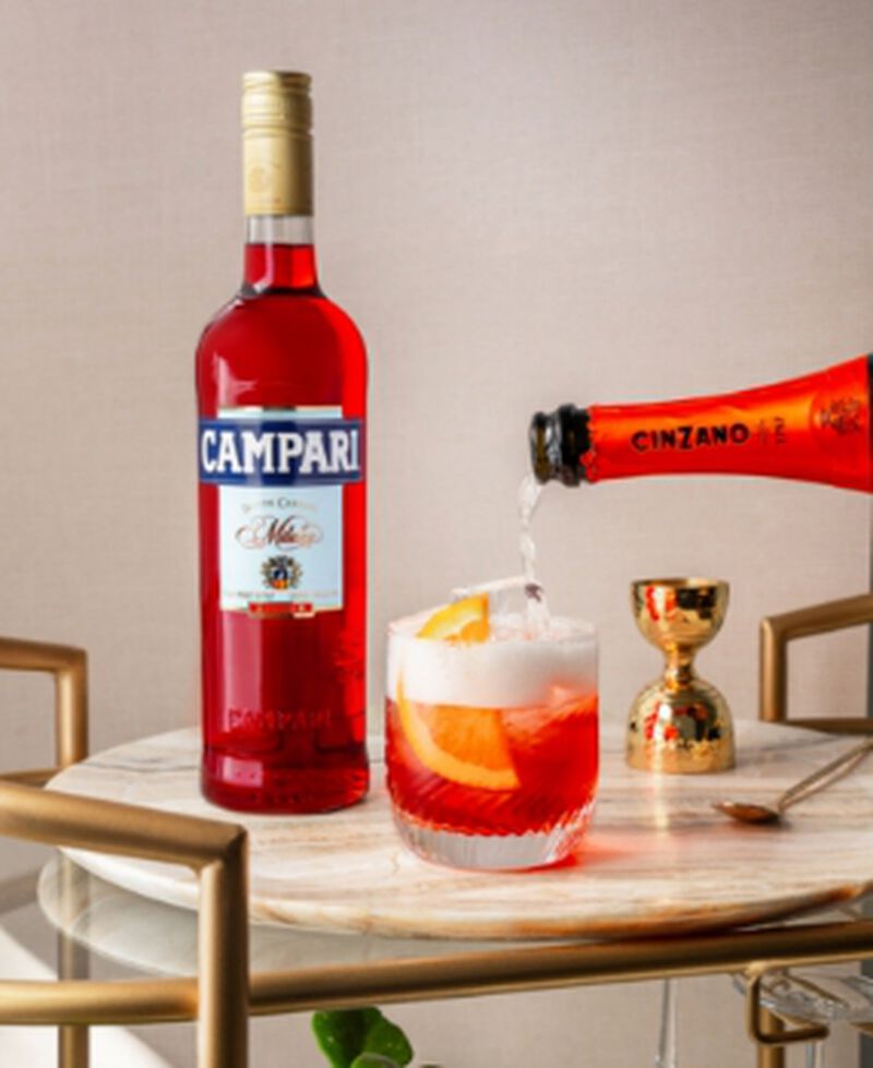 Bottle of Campari with a cocktail