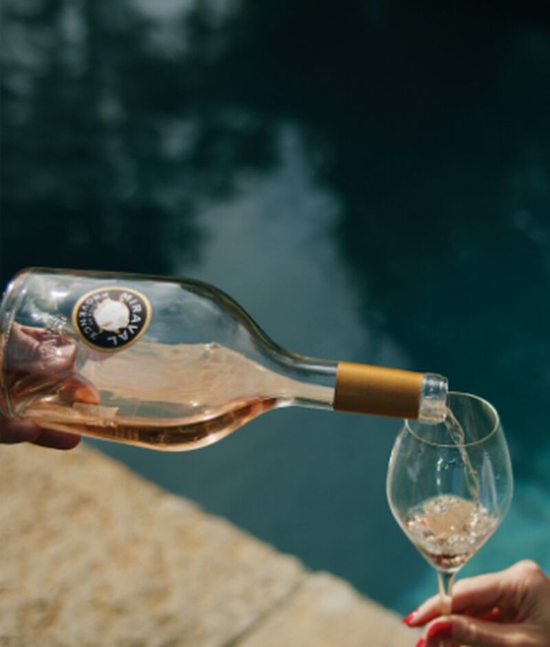 Miraval Rosé being poured by the pool